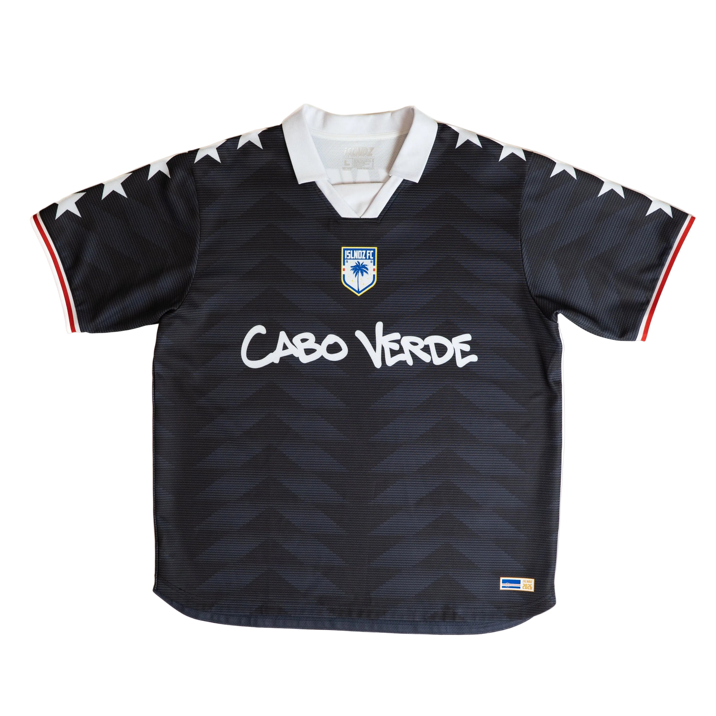 A vintage black soccer jersey with a white collar, white 'Cabo Verde' text across the chest, white stars along the shoulders, and red and white striped sleeve cuffs, laid flat against a white background.